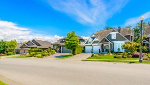 Stock image of residential neighborhood where each home needs radon testing.
